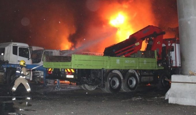 A dozen trucks damaged in suspected arson attack near HK box terminal